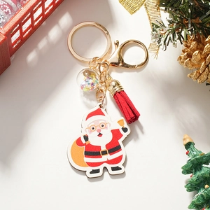 Dettaglio portachiavi Babbo Natale in legno con nappa e sfera con paillettes
