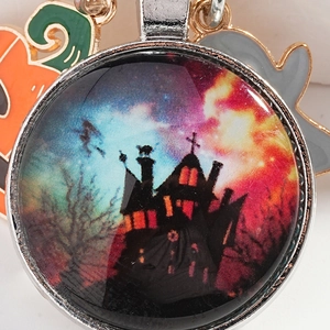 Halloween keychain with glass castle pendant, orange pumpkin and ghost charms