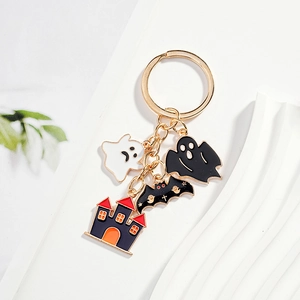 Halloween keychain with ghost, bat, and castle charms in gold-plated stainless steel