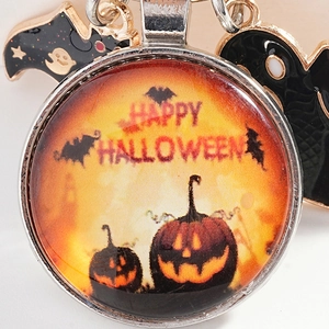Halloween glass pendant featuring Happy Halloween pumpkin and bat on a metal base