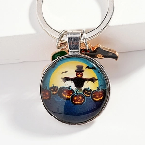 Halloween keychain featuring pumpkin scarecrow glass pendant and silver bat charm