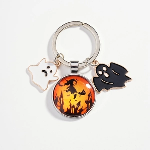 Halloween keychain with witch glass dome and black and white ghost charms in silver