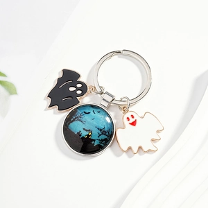 Halloween keychain featuring blue night castle glass dome with ghost and bat charms