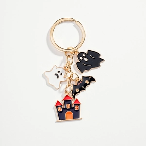 Halloween keychain with ghost bat and castle charms in vibrant gold finish