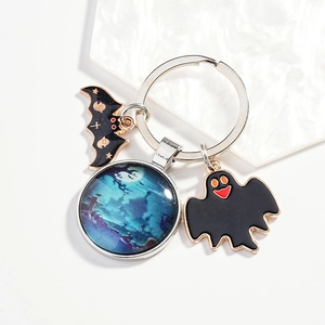 Halloween keychain with metal bat, ghost charms and moonlit forest glass pendant