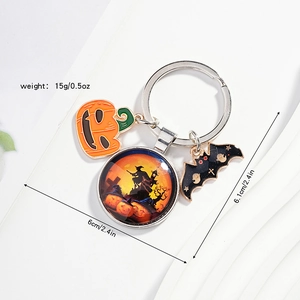 Detail view of Halloween keychain featuring pumpkin, bat charms and glass bead ornaments