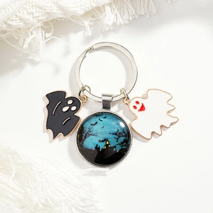 Halloween keychain featuring blue castle glass gem and black white ghost charms