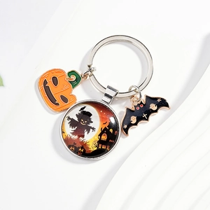 Halloween keychain with pumpkin, bat charms and scarecrow castle glass dome pendant
