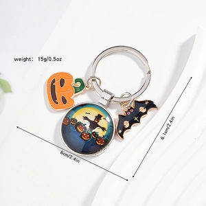 Detail of Halloween keychain showing pumpkin, bat charms, and glass pendant dimensions