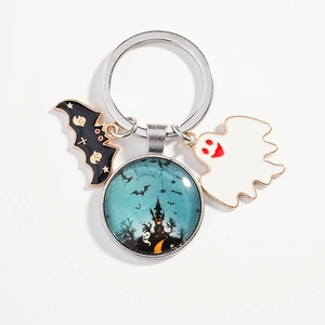DIY Halloween keychain with ghost, metal bat and castle glass pendant on white background