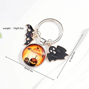 Detail of Halloween keychain with pumpkin, bat, and ghost charms in gold and orange finish
