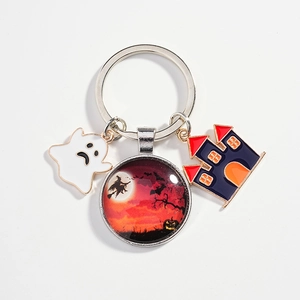 Halloween keychain with ghost, witch glass cabochon, and haunted castle charms