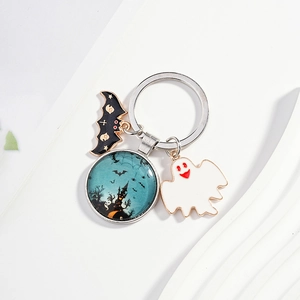 Halloween keychain with enamel bat ghost and glass castle charms on a silver ring