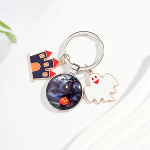 Halloween keychain with castle pendant, ghost charm and glass pumpkin night scene ball