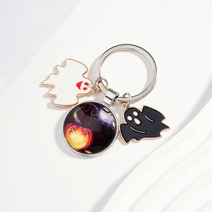 Halloween keychain with pumpkin glass pendant and black and white ghost charms