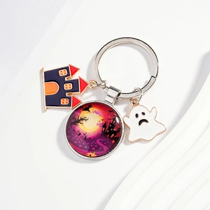 Halloween keychain with cartoon witch castle glass dome and small ghost metal pendants
