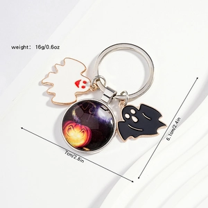 Detail view of Halloween keychains showing ghost charms and dimensions 7cm x 6.1cm