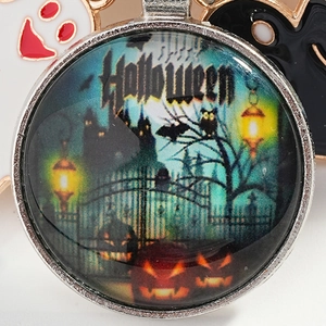 Halloween keychain with green castle glass dome, pumpkin lantern and ghost charm accessories