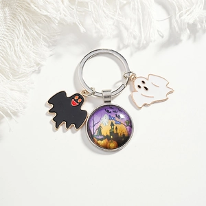Halloween keychain with spooky castle glass pendant and bat ghost enamel charms