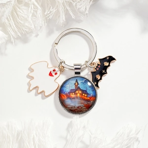 Halloween keychain with blue castle glass pendant, white ghost, and black bat charms