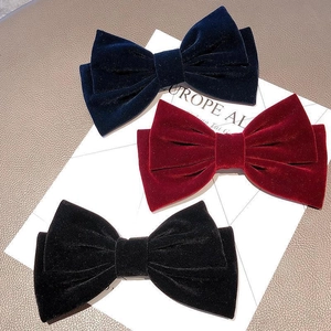 Set di tre fermagli per capelli con fiocco in velluto nei colori blu, rosso e nero
