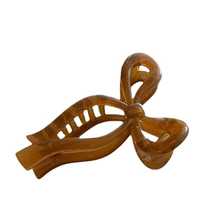 Elegant large amber brown ribbon bow hair claw clip for women with acrylic finish