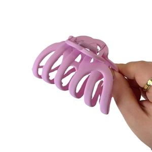 Minimalist matte lilac shark hair claw clip for thick hair shown on a white background