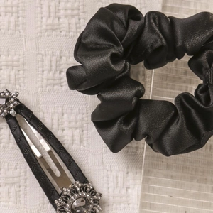 Elegant black satin scrunchie and rhinestone hair clip set for sophisticated hairstyles