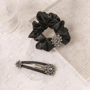 Luxurious black satin hair scrunchie and clip set with sparkling rhinestone snowflake decor