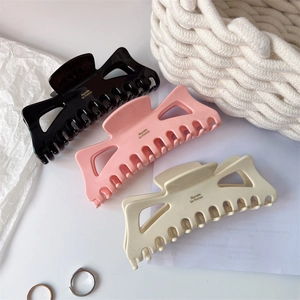 Three-color set of large acetate hair claws with gold Barrette la France logo print