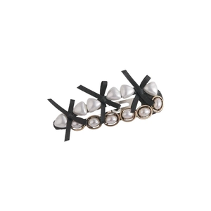 Vintage hair clip with black ribbon bow and white heart-shaped pearls on metal base
