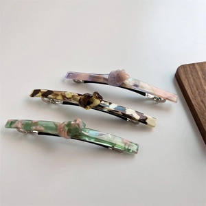Three-piece set of twisted acetate hair clips with marble and tortoiseshell patterns