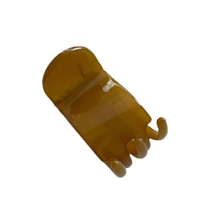 Minimalist amber tortoise shell hair claw clip in translucent acrylic with a wide top