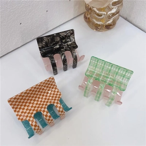 Large checkerboard and marble pattern acetate hair clips for women in three vibrant colors
