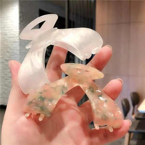 Elegant large acetate hair claws in pearl white and colorful floral mosaic patterns