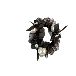 Elegant black mesh scrunchie with white pearls, satin bow, and crystals for women