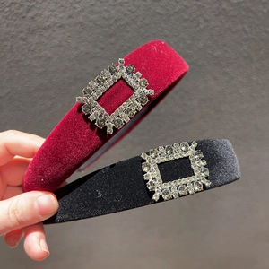 Detail view of burgundy and black velvet headbands featuring luxury square rhinestone buckles