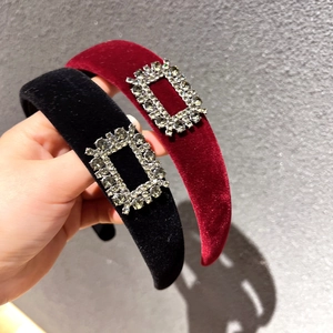 Detail of luxury velvet headband with wide sponge padding and sparkling rhinestone buckle