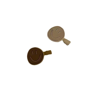 Classic smiley face charms in brown and beige silicone for shoe or bag accessories