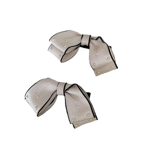 Elegant white fabric bow hair clips with black trim and small pearls for women