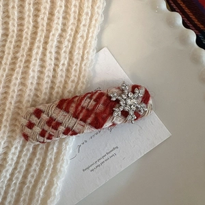 Red tweed plaid hair clip with crystal snowflake decor on a white aesthetic background