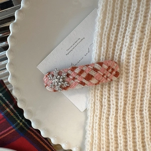 Winter plaid knitted hair clip with rhinestone snowflake accent in festive pink and white