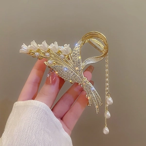 Golden lily of the valley hair claw clip with white pearls and sparkling rhinestone tassels