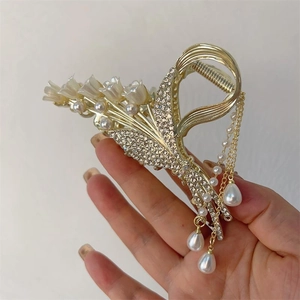Elegant lily of the valley gold claw clip with pearls and long tassels hair accessory
