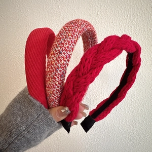 Three-piece set of festive red headbands in corduroy, tweed, and thick knit textures