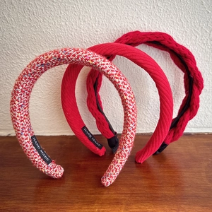 Three-piece red festive headband set in tweed and woven textures for a high skull top look