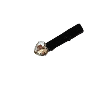 Elegant velvet hair clip featuring a sparkling champagne crystal heart on a black base