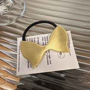 Elegante elastico per capelli con fiocco in metallo dorato e fascia nera per donna