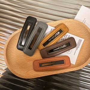 5-pack rectangular leather hair clips with stitching in various earthy neutral colors