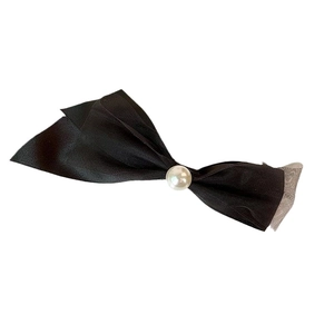 Elegant black bow hair clip with a centered pearl bead and mesh layer on white background